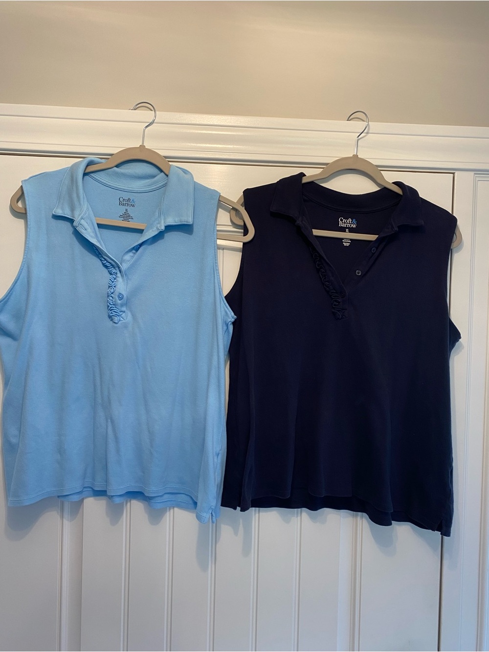 Croft & Barrow sleeveless polos, one navy and one light blue